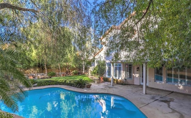 outdoor pool with a patio