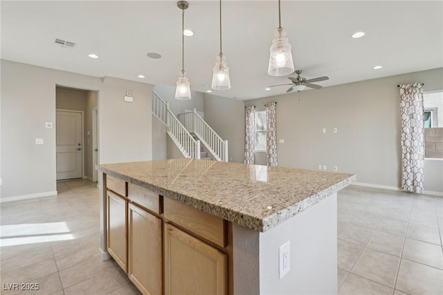 kitchen with ceiling fan, recessed lighting, visible vents, and a center island