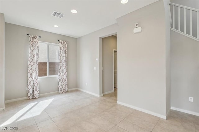 unfurnished room featuring recessed lighting, baseboards, visible vents, and light tile patterned floors