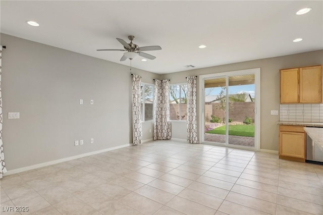 unfurnished living room featuring recessed lighting, baseboards, light tile patterned flooring, and a ceiling fan