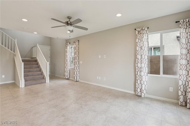 unfurnished living room with recessed lighting, baseboards, ceiling fan, and stairs