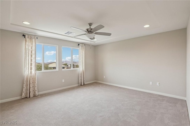 empty room featuring visible vents, baseboards, carpet floors, recessed lighting, and a ceiling fan