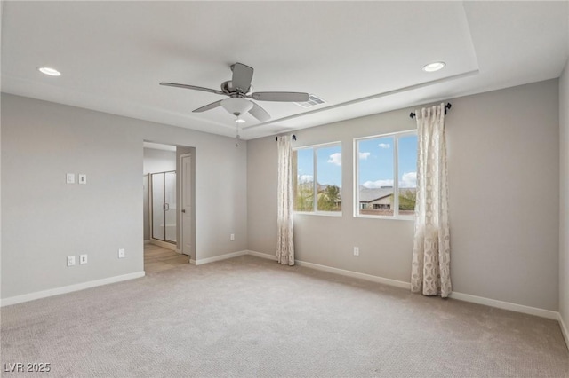 unfurnished room featuring visible vents, light carpet, baseboards, and a ceiling fan