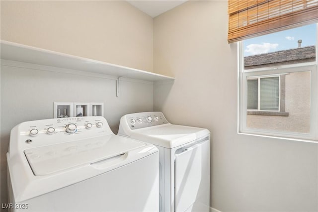 washroom featuring laundry area and washing machine and dryer