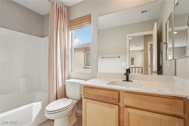 bathroom with vanity, shower / bath combo with shower curtain, toilet, and visible vents