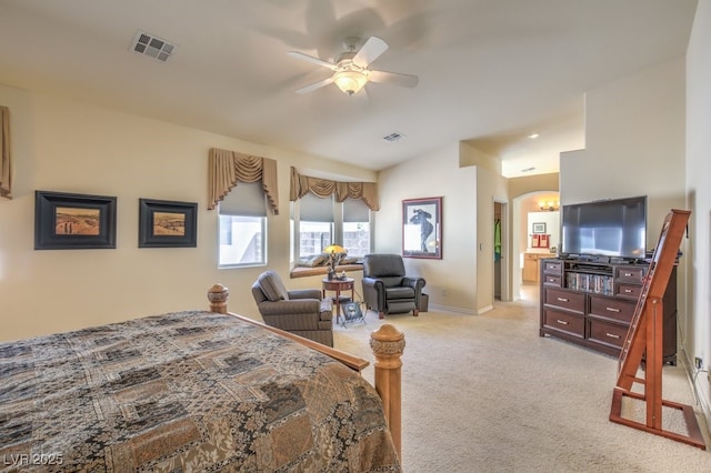 bedroom featuring visible vents, light colored carpet, baseboards, and ceiling fan