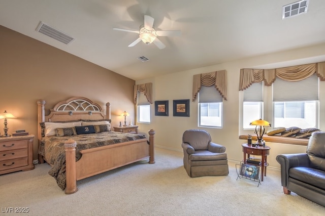 bedroom featuring visible vents and light colored carpet