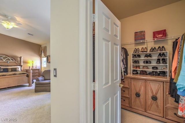 wine room featuring light carpet and visible vents