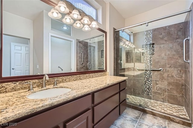 full bathroom featuring vanity and a shower stall