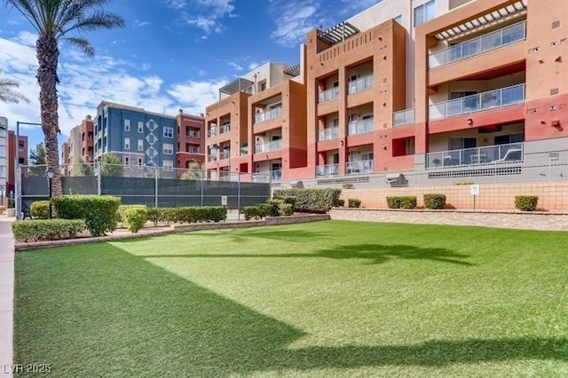 view of home's community with fence