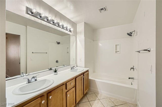 bathroom with tile patterned floors, visible vents, tub / shower combination, and a sink