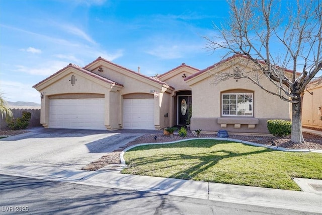 mediterranean / spanish house with stucco siding, a front lawn, concrete driveway, and an attached garage