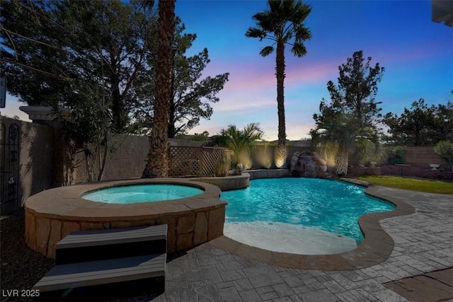 view of pool with a fenced in pool, a patio, an in ground hot tub, and a fenced backyard