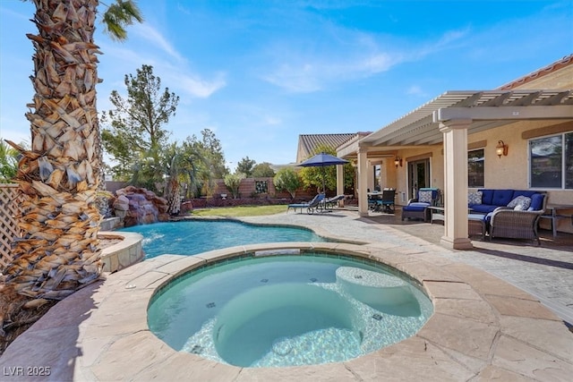 view of swimming pool with a patio, fence, a pool with connected hot tub, and an outdoor hangout area