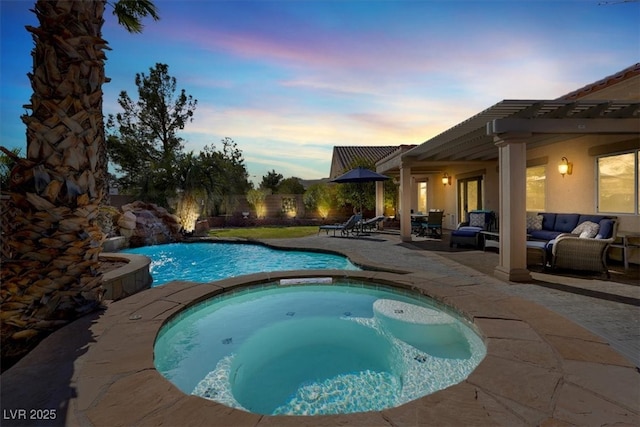 view of pool with an outdoor living space, a pool with connected hot tub, and a patio area