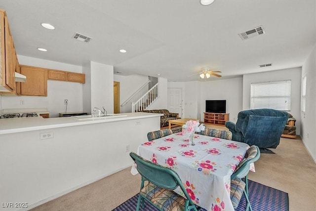 dining area with stairway, recessed lighting, a ceiling fan, and visible vents