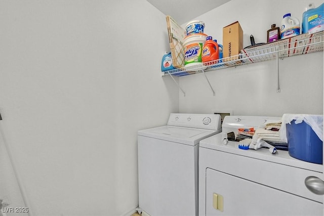 laundry area featuring laundry area and washer and clothes dryer