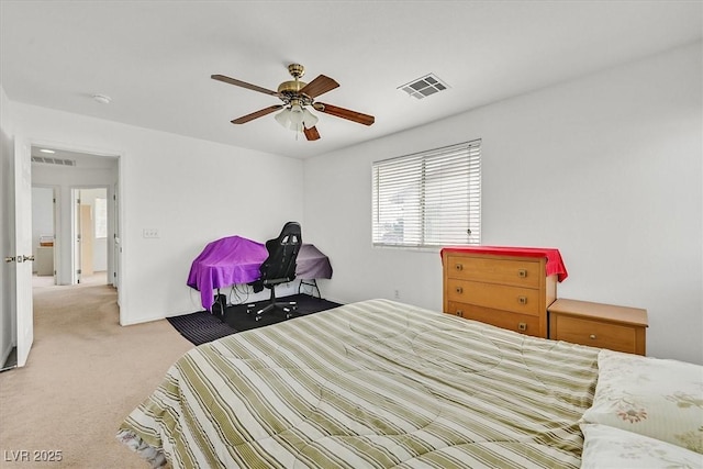 bedroom featuring visible vents, ceiling fan, and carpet floors