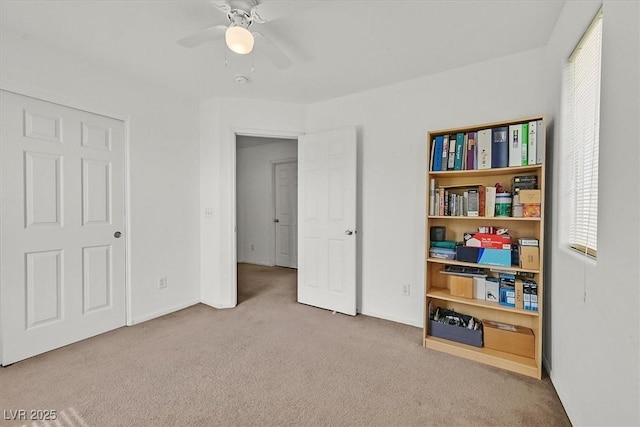 bedroom with multiple windows, a ceiling fan, and carpet floors