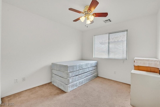 carpeted bedroom featuring visible vents and ceiling fan