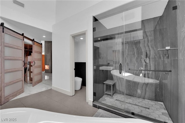 8170 Round Hills Cir, Las Vegas, NV 89113 - bathroom with a stall shower, a freestanding tub, recessed lighting, and toilet