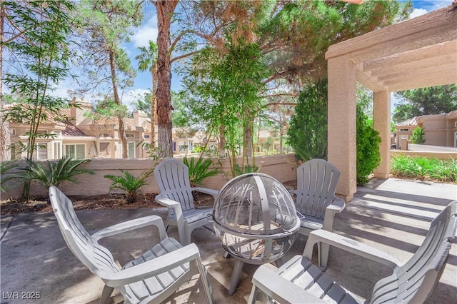 8170 Round Hills Cir, Las Vegas, NV 89113 - view of patio / terrace featuring a fire pit