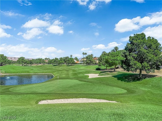 8170 Round Hills Cir, Las Vegas, NV 89113 - view of home's community featuring a water view, golf course view, a putting area, and a yard