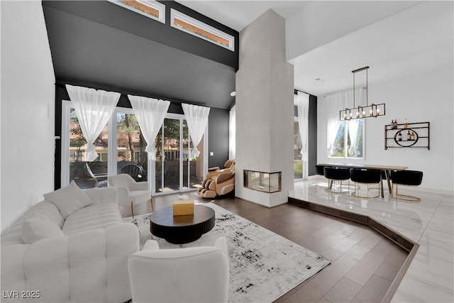 8170 Round Hills Cir, Las Vegas, NV 89113 - living area featuring a chandelier and wood finished floors