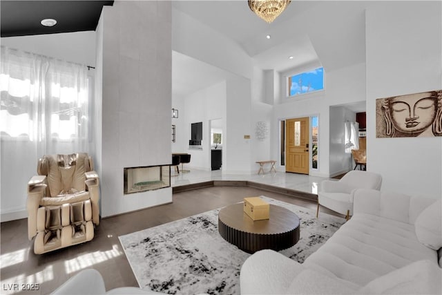 8170 Round Hills Cir, Las Vegas, NV 89113 - living area with high vaulted ceiling, wood finished floors, and baseboards