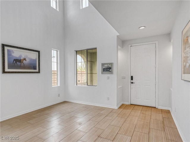 entrance foyer featuring baseboards and light wood-style flooring