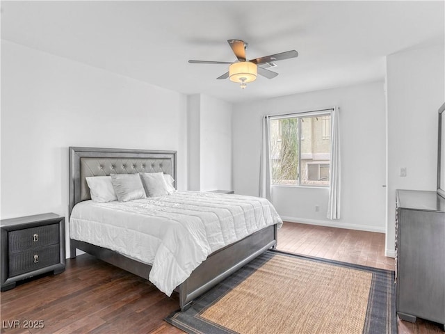 bedroom featuring a ceiling fan, baseboards, and wood-type flooring