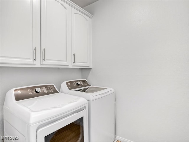 laundry room featuring cabinet space and washing machine and dryer