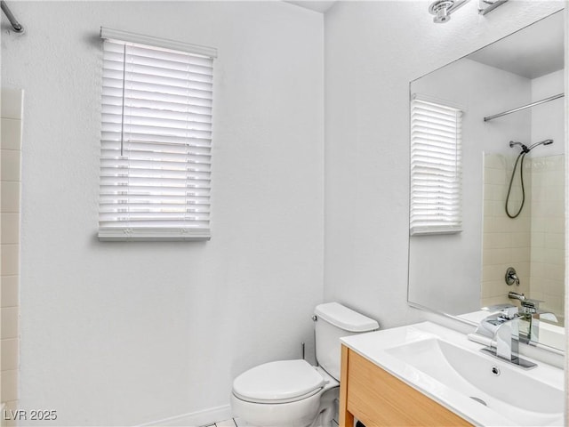 full bathroom with toilet and vanity