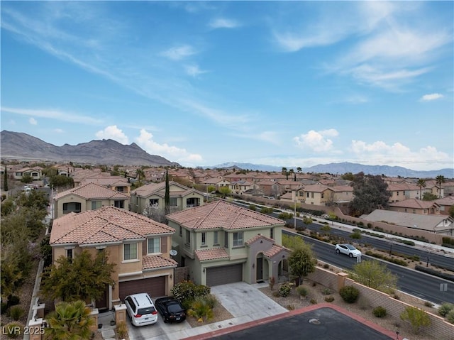 bird's eye view featuring a mountain view and a residential view