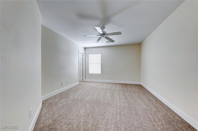 unfurnished room featuring light carpet, baseboards, and a ceiling fan