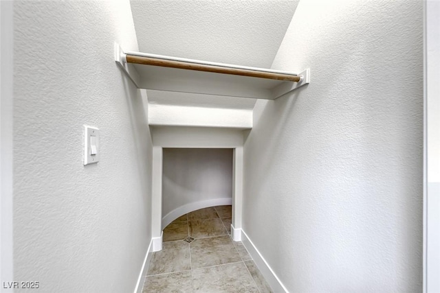 walk in closet featuring light tile patterned floors