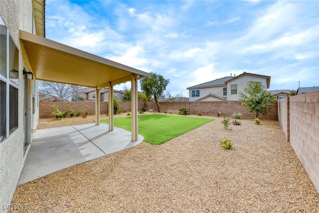 view of yard featuring a fenced backyard and a patio