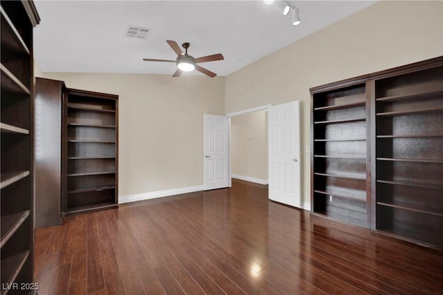 interior space featuring ceiling fan, wood finished floors, visible vents, and baseboards