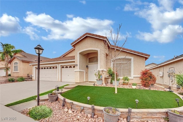 view of front of home featuring a garage, driveway, and stucco siding