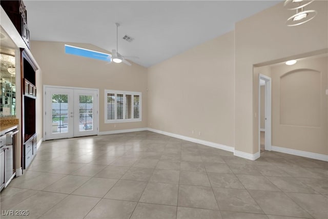 unfurnished living room featuring visible vents, baseboards, ceiling fan, light tile patterned floors, and high vaulted ceiling