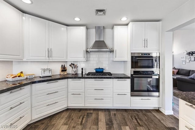 8433 Honeywood Cir, Las Vegas, NV 89128 - kitchen with wall chimney exhaust hood, stainless steel appliances, white cabinetry, and recessed lighting