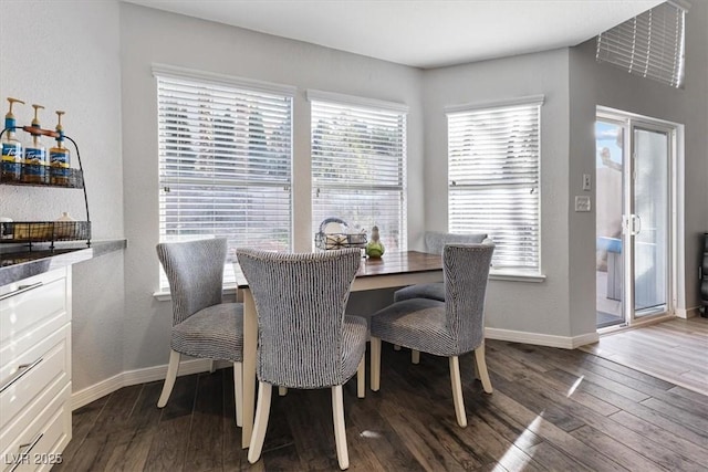 8433 Honeywood Cir, Las Vegas, NV 89128 - dining space with baseboards and dark wood-style floors