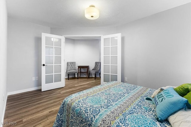 8433 Honeywood Cir, Las Vegas, NV 89128 - bedroom featuring french doors, wood finished floors, and baseboards