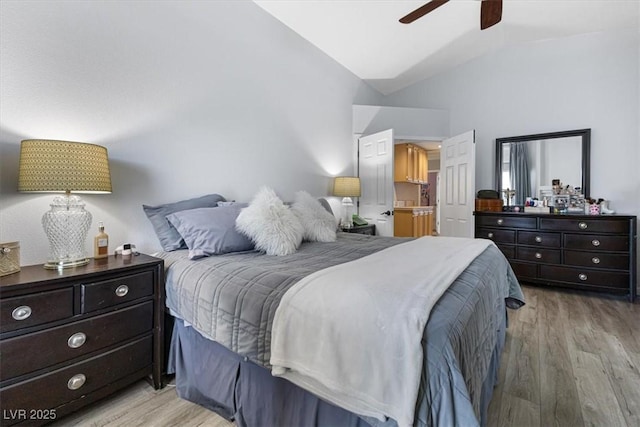 8433 Honeywood Cir, Las Vegas, NV 89128 - bedroom featuring light wood finished floors, ceiling fan, and high vaulted ceiling