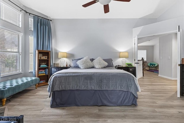 8433 Honeywood Cir, Las Vegas, NV 89128 - bedroom with light wood-style flooring, ceiling fan, and baseboards
