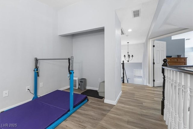 8433 Honeywood Cir, Las Vegas, NV 89128 - exercise area featuring wood finished floors, baseboards, a chandelier, and recessed lighting
