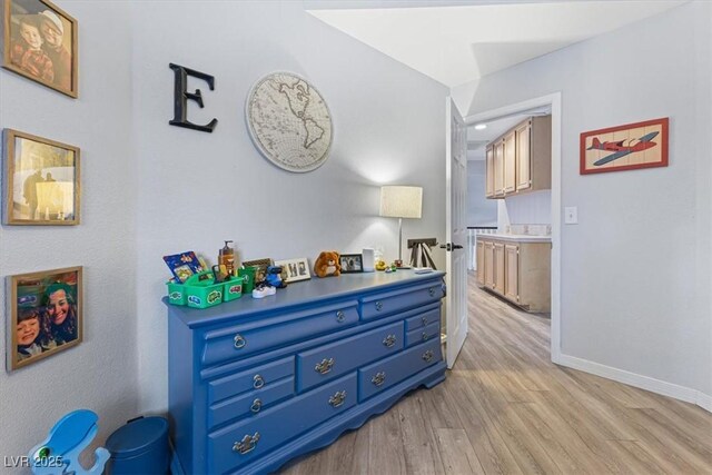 8433 Honeywood Cir, Las Vegas, NV 89128 - hall featuring light wood-type flooring and baseboards