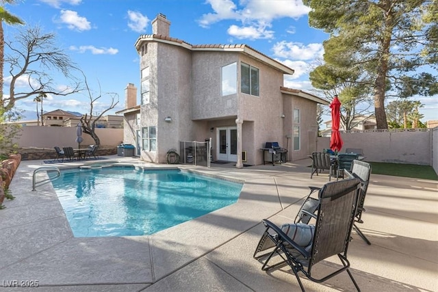 8433 Honeywood Cir, Las Vegas, NV 89128 - view of swimming pool featuring french doors, a patio area, a fenced backyard, and a grill