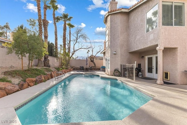 8433 Honeywood Cir, Las Vegas, NV 89128 - view of pool featuring french doors, a fenced backyard, and a patio area