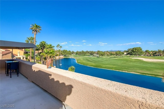 view of pool with a yard, golf course view, and a water view